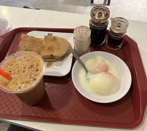 Kaya toast, soft-boiled eggs, and iced coffee at Ya Kun Kaya Toast